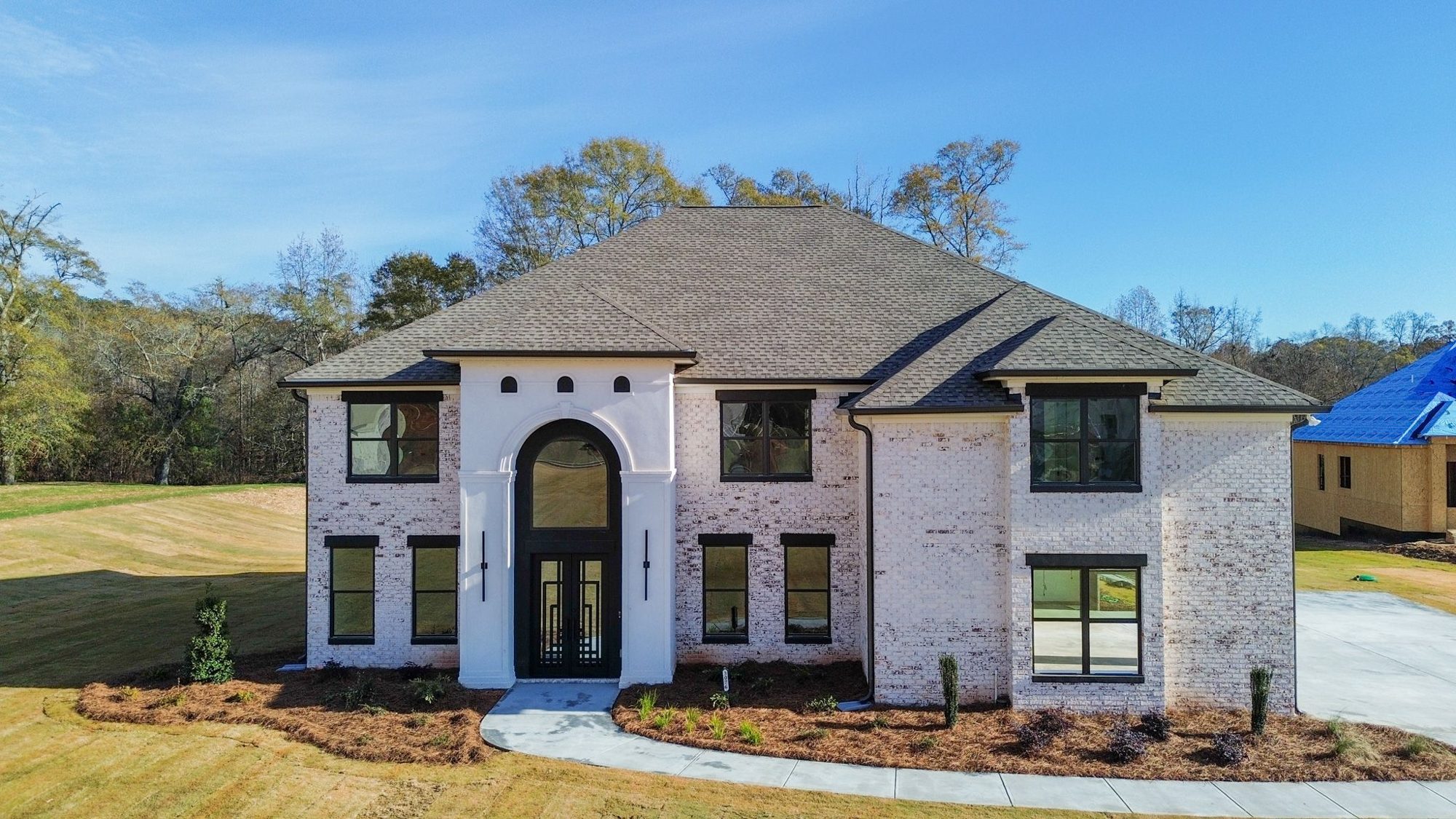 Aerial photograph of a brick luxury home in Conyers, Georgia