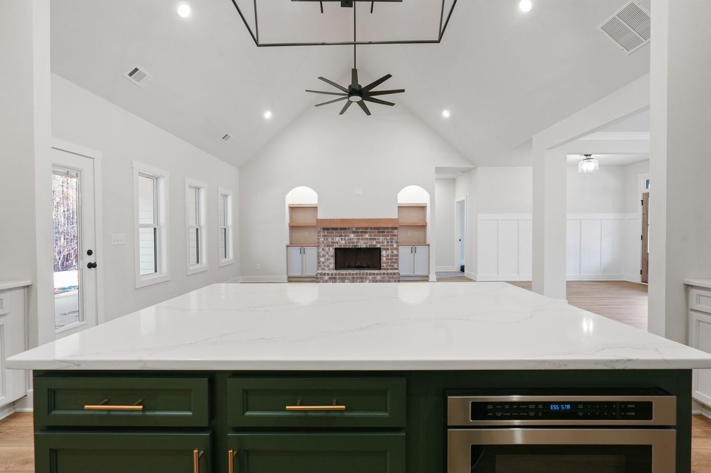 Kitchen island and vaulted great room in a new build home in Dallas, Georgia