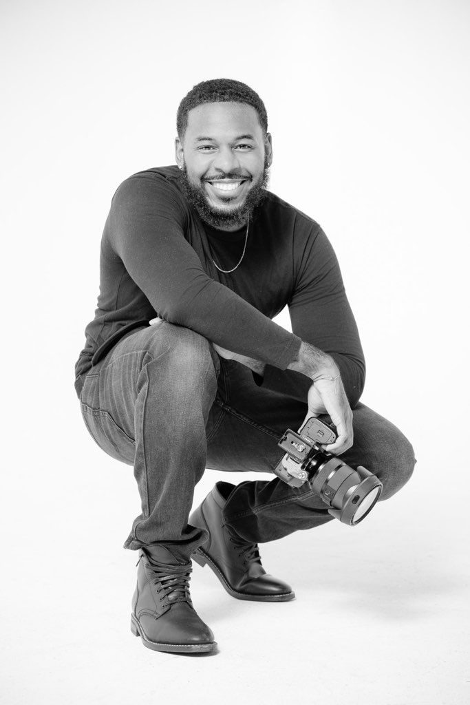 Devon Montgomery holding his camera
